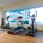 Minimalist 1Br Without Living Room Grand Kamala Lagoon Apartment By Travelio